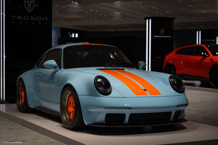 Automotive photograph with dramatic lighting on bodywork